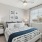 BEDROOM WITH WOOD PLANK-STYLE FLOORING AND CEILING FAN
